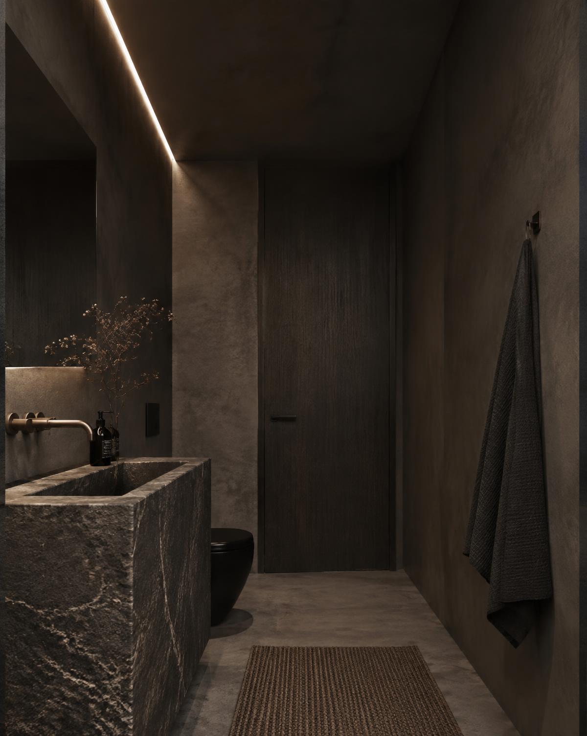 Dark minimal bathroom with a linear ceiling light slot